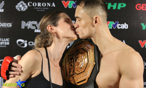 Vietnamese Polish fighter kisses wife to celebrate MMA championship